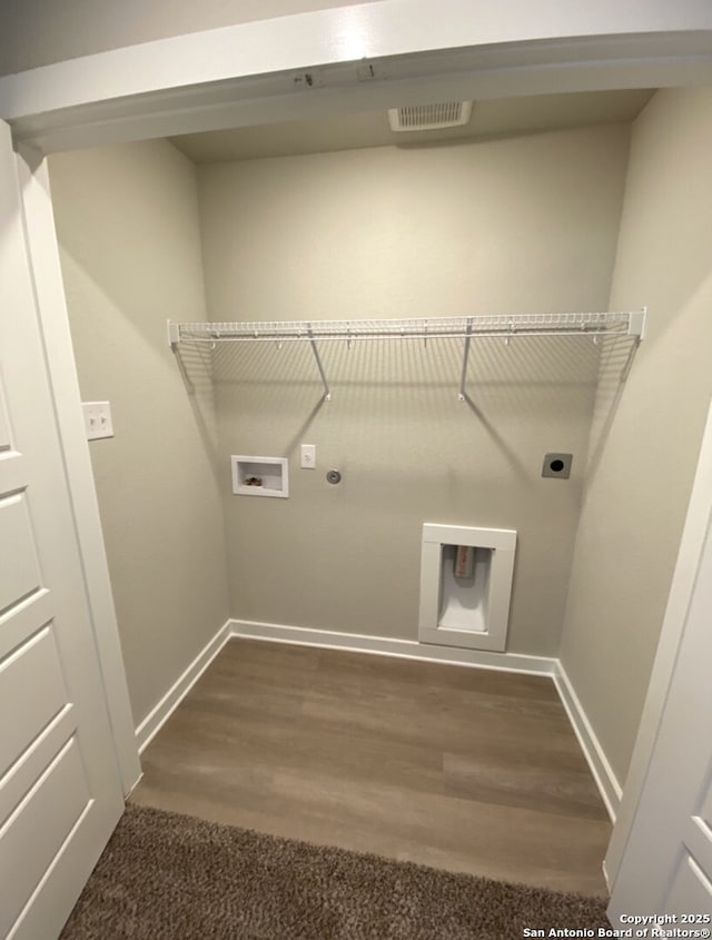 7003 Emerald Vly, San Antonio, TX 78242 - laundry room with hookup for an electric dryer, baseboards, gas dryer hookup, washer hookup, and dark wood finished floors