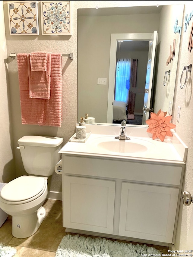 7003 Emerald Vly, San Antonio, TX 78242 - half bathroom featuring vanity, a textured wall, and toilet