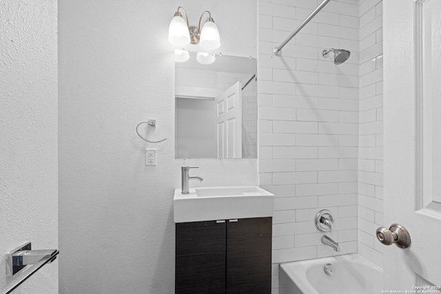 402 E Dewey, San Antonio, TX 78212 - full bathroom featuring vanity, bathing tub / shower combination, and a textured wall