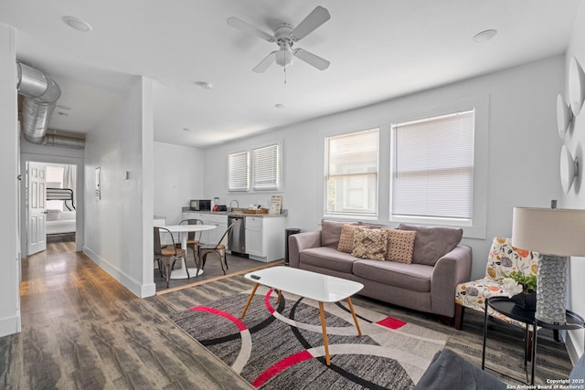 402 E Dewey, San Antonio, TX 78212 - living area featuring wood finished floors, ceiling fan, and baseboards