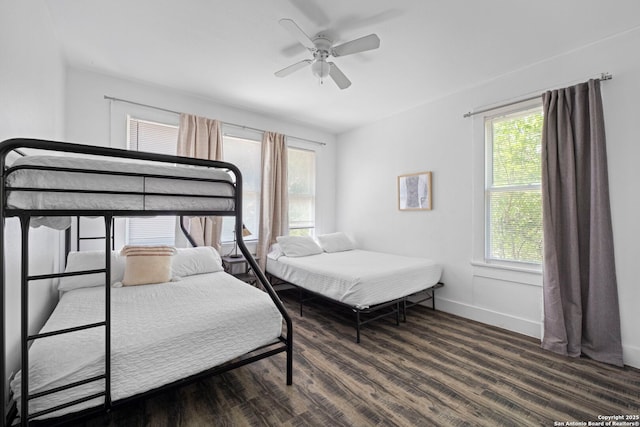 402 E Dewey, San Antonio, TX 78212 - bedroom with wood finished floors, multiple windows, baseboards, and a ceiling fan