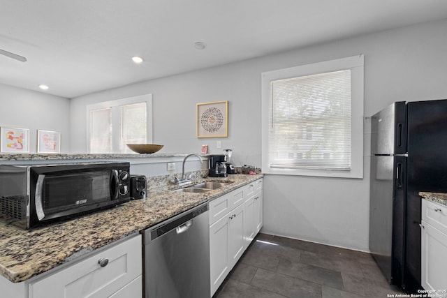 402 E Dewey, San Antonio, TX 78212 - kitchen featuring black appliances, a sink, light stone counters, white cabinets, and recessed lighting