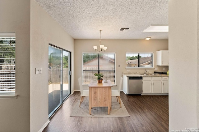5626 Spring Sunshine, San Antonio, TX 78247 - dining space featuring a textured ceiling, dark wood-style flooring, and a chandelier