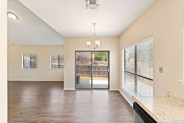 5626 Spring Sunshine, San Antonio, TX 78247 - unfurnished dining area featuring a chandelier, dark wood-style flooring, a textured ceiling, and baseboards