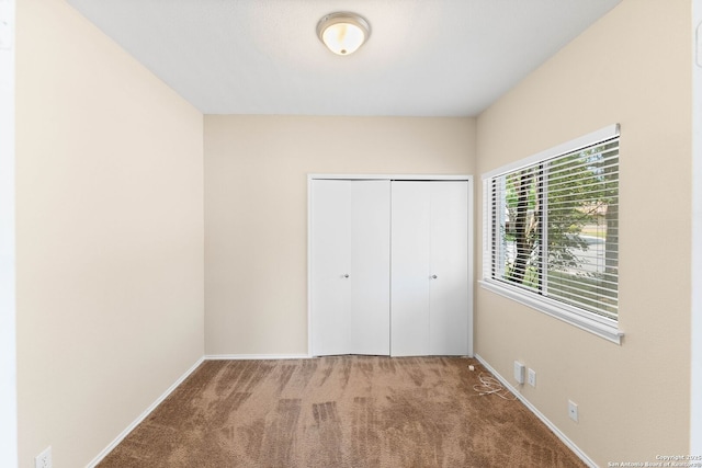 5626 Spring Sunshine, San Antonio, TX 78247 - unfurnished bedroom with carpet flooring, baseboards, and a closet