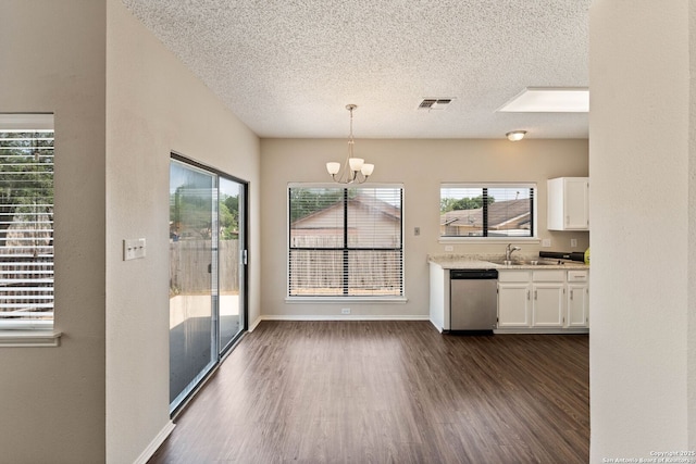 5626 Spring Sunshine, San Antonio, TX 78247 - kitchen with stainless steel dishwasher, white cabinets, a textured ceiling, dark wood-type flooring, and a sink