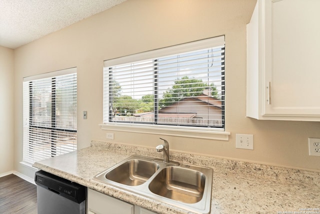 5626 Spring Sunshine, San Antonio, TX 78247 - kitchen featuring dishwasher, a sink, white cabinetry, and wood finished floors