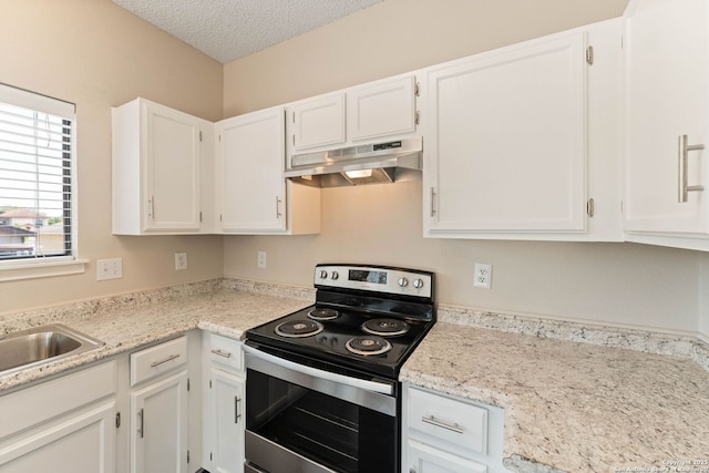 5626 Spring Sunshine, San Antonio, TX 78247 - kitchen with stainless steel electric range, under cabinet range hood, white cabinetry, a textured ceiling, and a sink