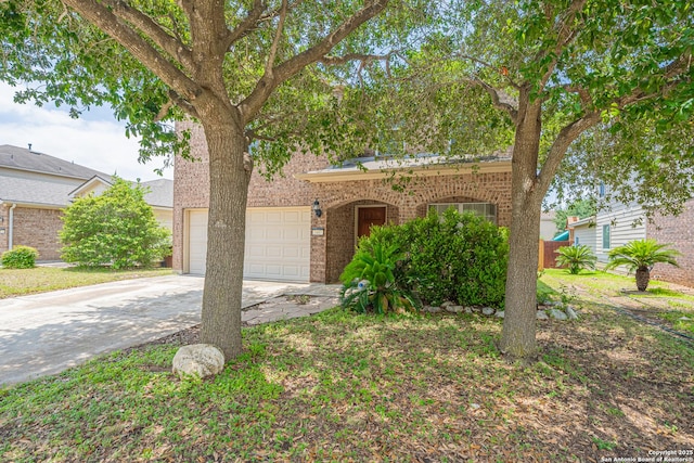 3407 Maguey Trl, San Antonio, TX 78245 - view of front of home with driveway and brick siding