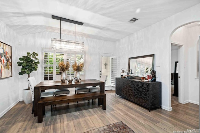 3714 Cotoneaster, San Antonio, TX 78261 - dining room with arched walkways, wood finished floors, a chandelier, and baseboards