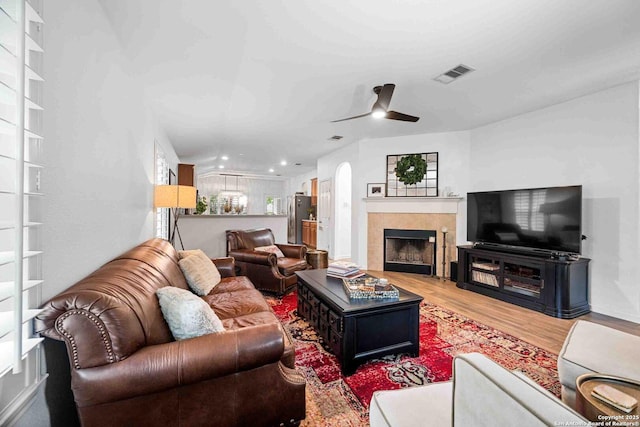 3714 Cotoneaster, San Antonio, TX 78261 - living room featuring ceiling fan, wood finished floors, a fireplace, recessed lighting, and arched walkways