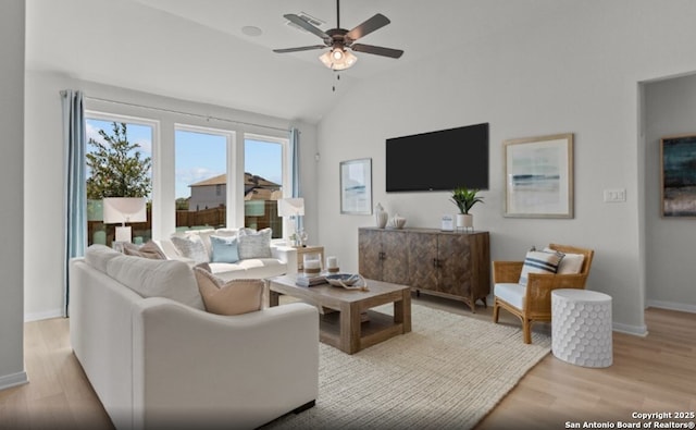 6407 Penny Path, San Antonio, TX 78253 - living room featuring light wood-style floors, ceiling fan, vaulted ceiling, and baseboards