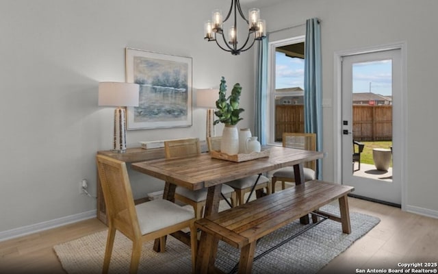 6407 Penny Path, San Antonio, TX 78253 - dining space with a chandelier, light wood finished floors, and baseboards