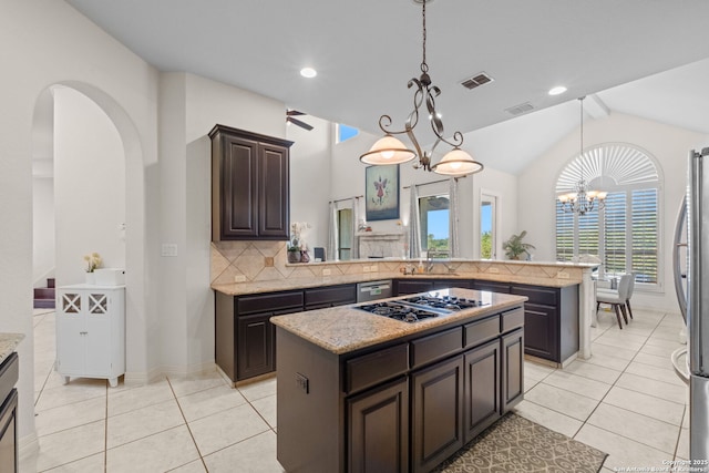 846 Fawnway, San Antonio, TX 78260 - kitchen with stainless steel appliances, light tile patterned flooring, lofted ceiling, decorative backsplash, and dark brown cabinets