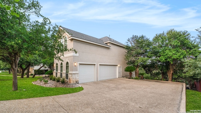 846 Fawnway, San Antonio, TX 78260 - view of home's exterior featuring stucco siding, driveway, stone siding, and a lawn