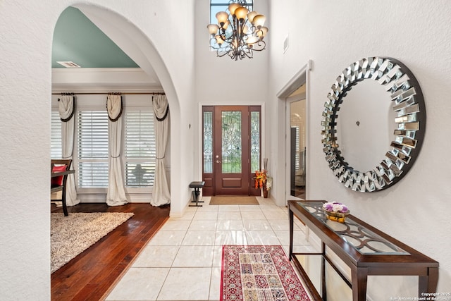 846 Fawnway, San Antonio, TX 78260 - foyer entrance featuring a chandelier, arched walkways, and tile patterned floors