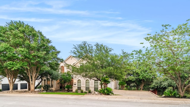 846 Fawnway, San Antonio, TX 78260 - obstructed view of property with driveway and stone siding