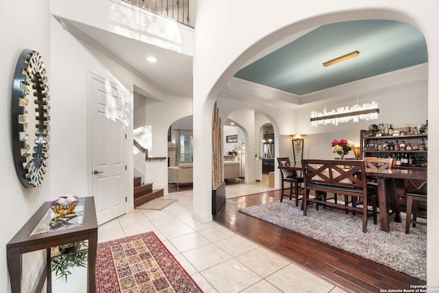 846 Fawnway, San Antonio, TX 78260 - dining area featuring arched walkways, light tile patterned floors, crown molding, stairway, and a towering ceiling