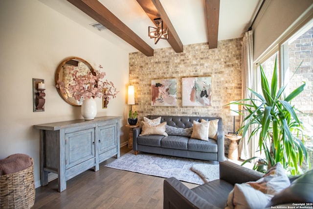 12805 Big Tank Rnch, San Antonio, TX 78245 - living room featuring a chandelier, beam ceiling, dark wood-style flooring, and baseboards