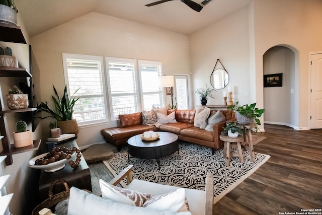 12805 Big Tank Rnch, San Antonio, TX 78245 - living room featuring arched walkways, wood finished floors, a ceiling fan, baseboards, and high vaulted ceiling