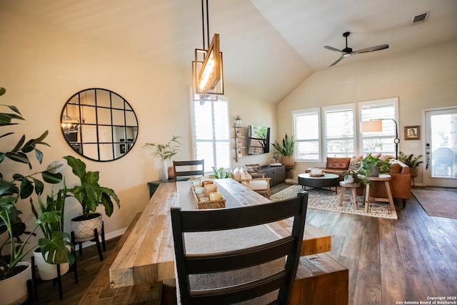 12805 Big Tank Rnch, San Antonio, TX 78245 - dining room featuring a ceiling fan, hardwood / wood-style flooring, high vaulted ceiling, and baseboards