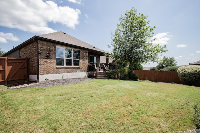 12805 Big Tank Rnch, San Antonio, TX 78245 - back of house with brick siding and a wooden deck