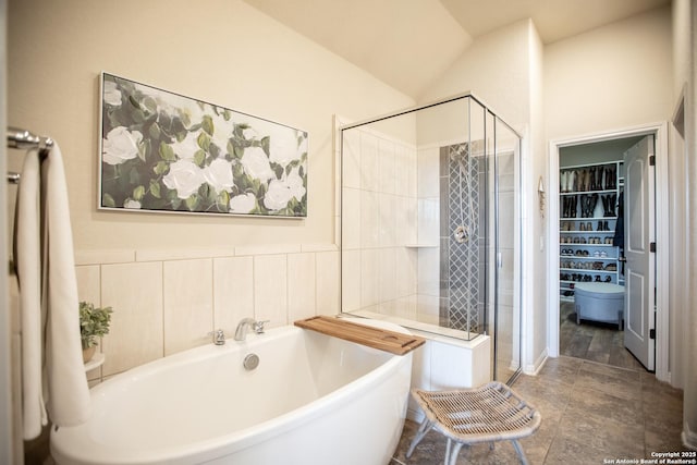 12805 Big Tank Rnch, San Antonio, TX 78245 - full bath with a stall shower, a freestanding bath, a walk in closet, and vaulted ceiling