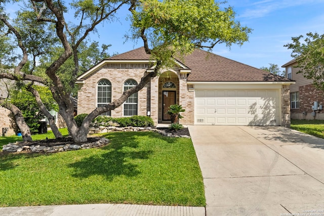 1015 Water Lily, San Antonio, TX 78260 - view of front of property featuring an attached garage, a front lawn, driveway, and brick siding