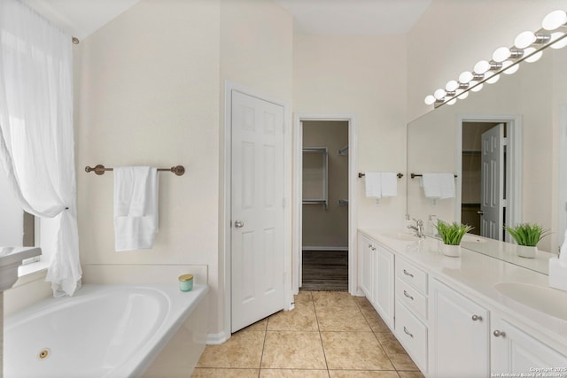 1015 Water Lily, San Antonio, TX 78260 - full bath featuring double vanity, a whirlpool tub, tile patterned floors, and a spacious closet