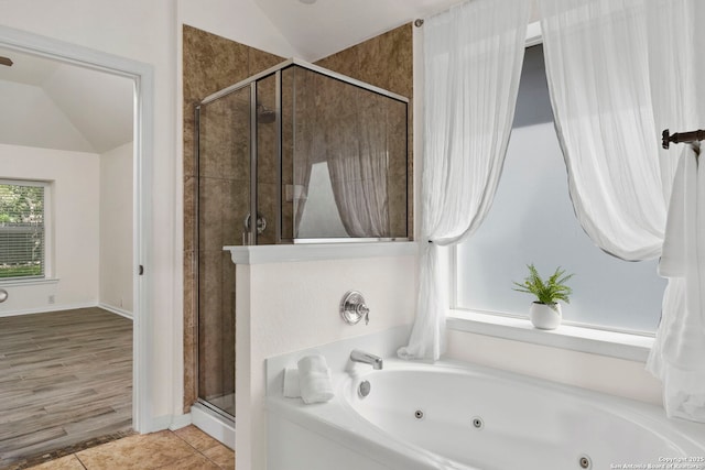 1015 Water Lily, San Antonio, TX 78260 - full bathroom with a stall shower, a tub with jets, vaulted ceiling, and tile patterned floors