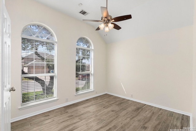 1015 Water Lily, San Antonio, TX 78260 - empty room with wood finished floors, a ceiling fan, vaulted ceiling, and baseboards
