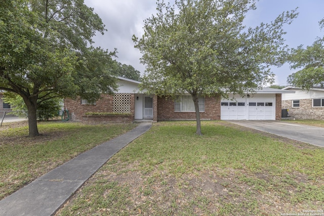 4326 Hall Park, San Antonio, TX 78218 - view of property hidden behind natural elements featuring a garage, concrete driveway, and brick siding