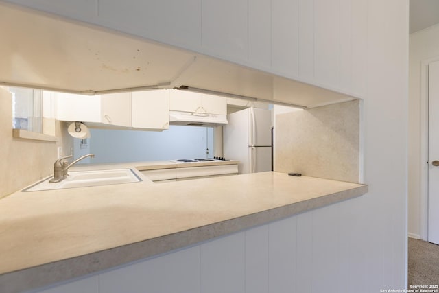 4326 Hall Park, San Antonio, TX 78218 - kitchen featuring white appliances, a sink, under cabinet range hood, white cabinetry, and light countertops