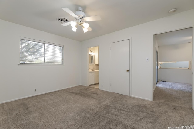 4326 Hall Park, San Antonio, TX 78218 - unfurnished bedroom featuring light colored carpet, baseboards, a sink, and ensuite bath