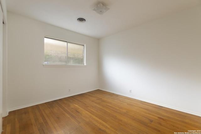 4326 Hall Park, San Antonio, TX 78218 - spare room featuring hardwood / wood-style floors and baseboards