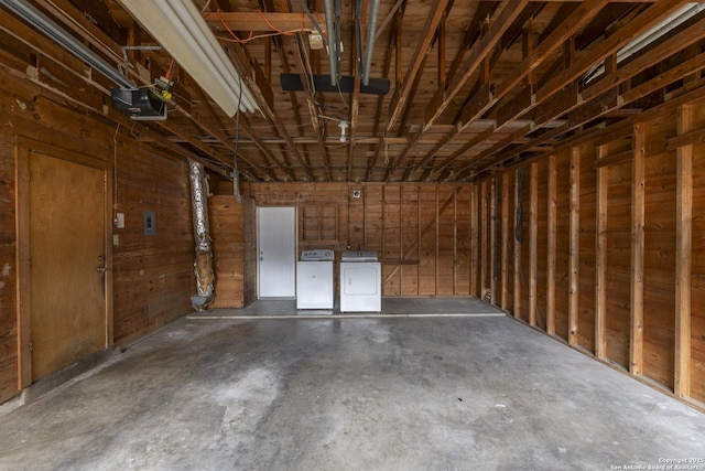4326 Hall Park, San Antonio, TX 78218 - garage featuring washing machine and clothes dryer and a garage door opener