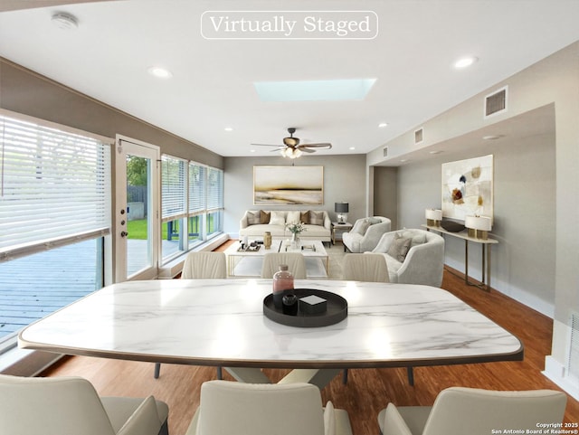 1002 Chevy Chase, San Antonio, TX 78209 - dining area with a skylight, wood finished floors, baseboards, a ceiling fan, and recessed lighting