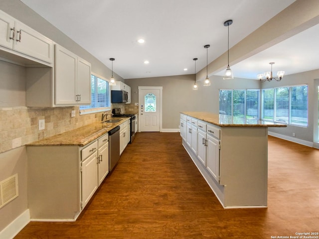 1002 Chevy Chase, San Antonio, TX 78209 - kitchen with appliances with stainless steel finishes, a sink, baseboards, light stone countertops, and white cabinetry