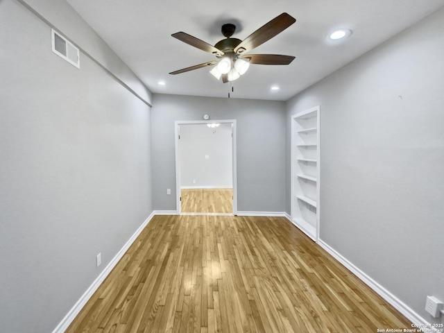 1002 Chevy Chase, San Antonio, TX 78209 - empty room featuring wood finished floors, a ceiling fan, baseboards, recessed lighting, and built in shelves