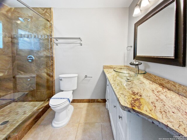 1002 Chevy Chase, San Antonio, TX 78209 - full bath with toilet, vanity, baseboards, tile patterned floors, and a tile shower