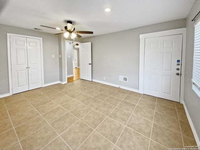 1002 Chevy Chase, San Antonio, TX 78209 - unfurnished bedroom with light tile patterned floors, baseboards, recessed lighting, ceiling fan, and a closet