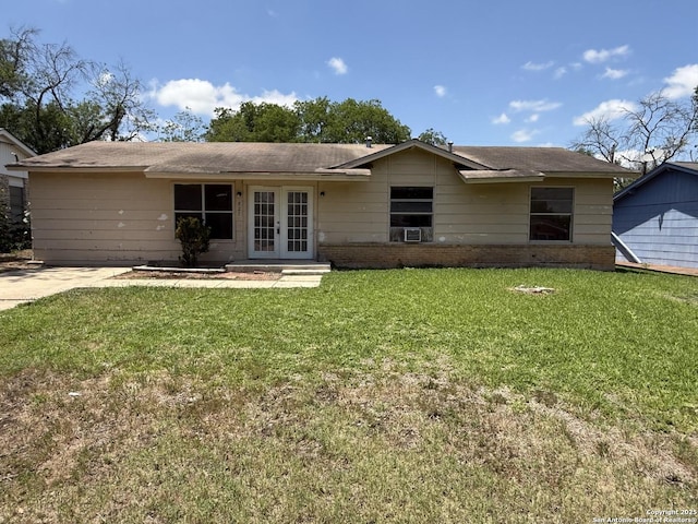 827 Horseshoe, Universal City, TX 78148 - view of front facade with french doors, brick siding, a front lawn, and cooling unit