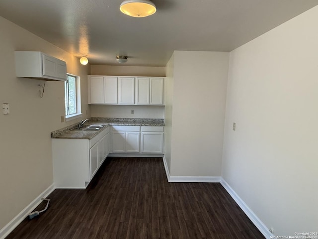 827 Horseshoe, Universal City, TX 78148 - kitchen featuring a sink, baseboards, white cabinets, and dark wood-style flooring