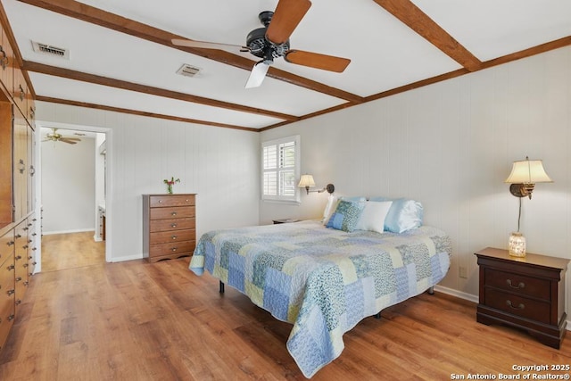 701 Steele, Smiley, TX 78159 - bedroom featuring beam ceiling, wood finished floors, crown molding, and a ceiling fan