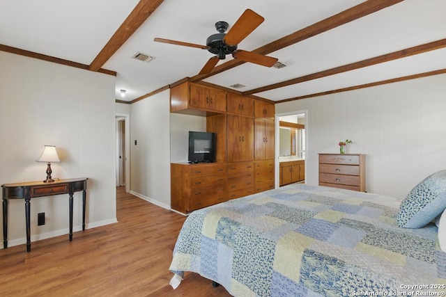 701 Steele, Smiley, TX 78159 - bedroom featuring beamed ceiling, wood finished floors, and baseboards