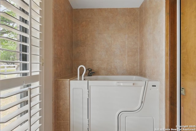 701 Steele, Smiley, TX 78159 - laundry room with radiator