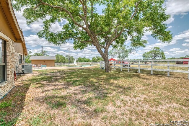 701 Steele, Smiley, TX 78159 - view of yard featuring central AC