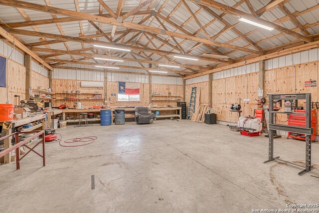 701 Steele, Smiley, TX 78159 - garage with a workshop area and metal wall