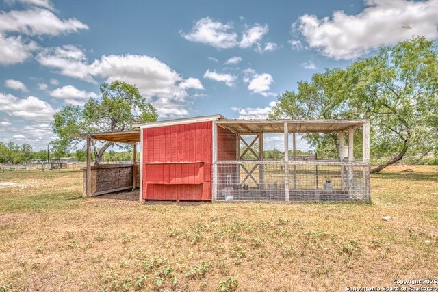 701 Steele, Smiley, TX 78159 - view of poultry coop with a lawn