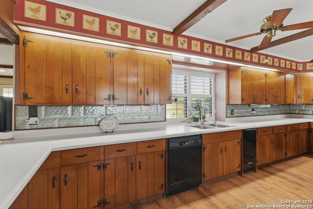 701 Steele, Smiley, TX 78159 - kitchen with black dishwasher, a sink, light countertops, tasteful backsplash, and brown cabinetry
